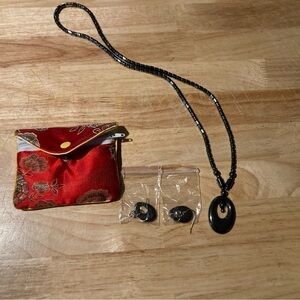 4/$25 Necklace & earring set in a pouch.Not sure of the brand
